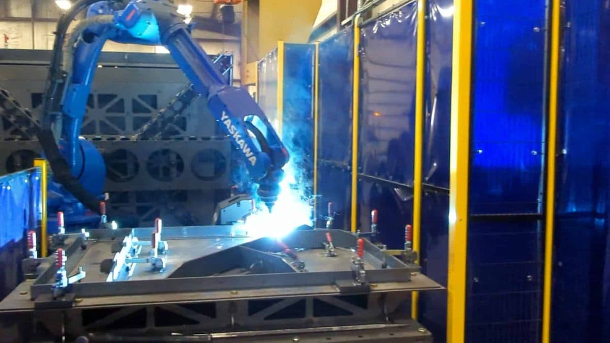 Robot welding cell with fixture and clamps
